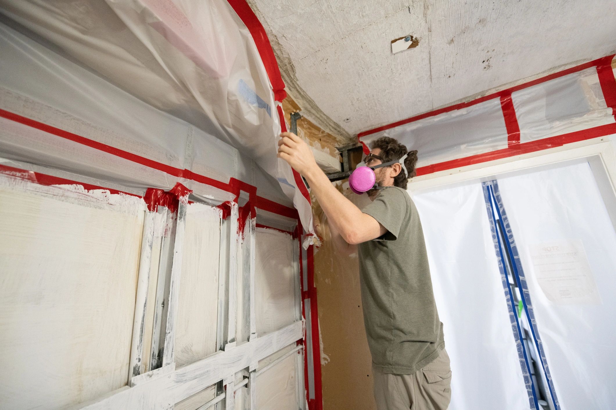 Restoration professional inspecting an interior after water damage