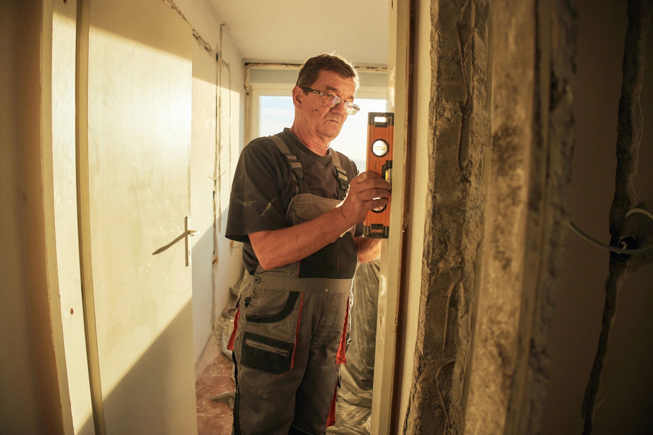 Restoration technician working inside a damaged room